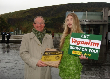 PETA’s ‘Lettuce Lady’ Descends on Holyrood With Vegan Pizza