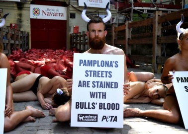 12 Iconic Photos From PETA’s Protests Against the Running of the Bulls