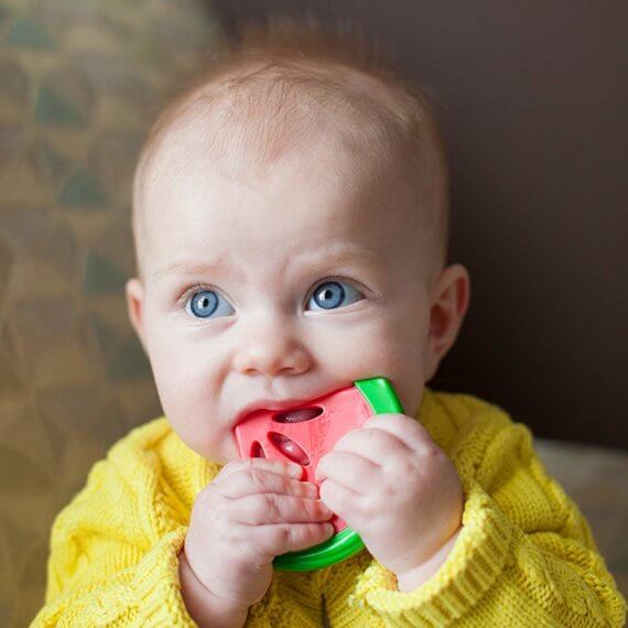Baby holding Dr Brown's Coolees Watermelon Teether