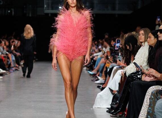 A model wearing Stella McCartney vegan feathers on the runway