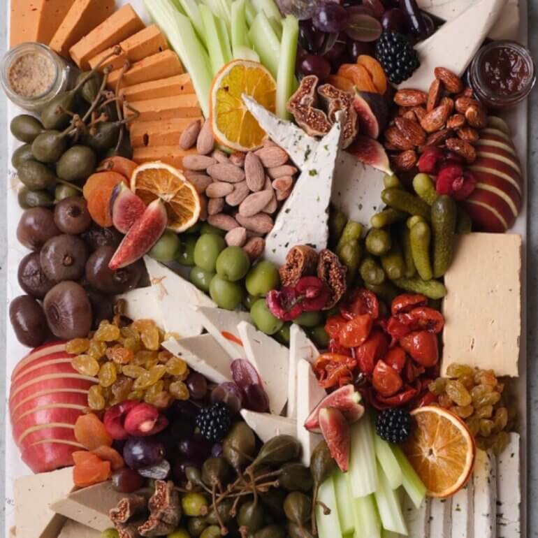A huge Christmas cheeseboard platter from Grape and Fig - featuring cheese, chutney, crackers, and fruit