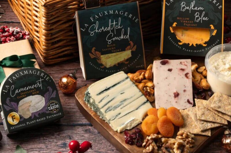 A vegan cheeseboard from La Fauxmagerie featuring artisan vegan cheeses, crackers, and fruit
