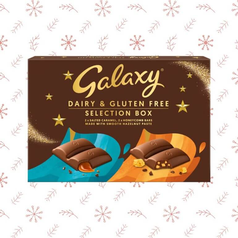 A vegan selection box from Galaxy in front of a red patterned background