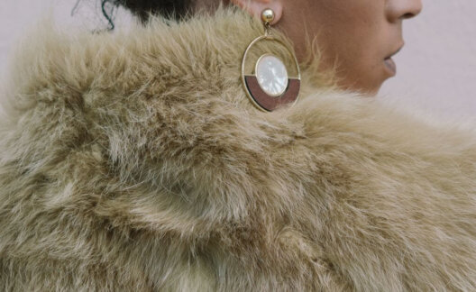 A woman wearing a faux fur coat