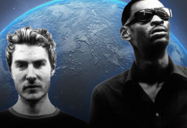 Two members of Massive Attack in front of a background depicting the world