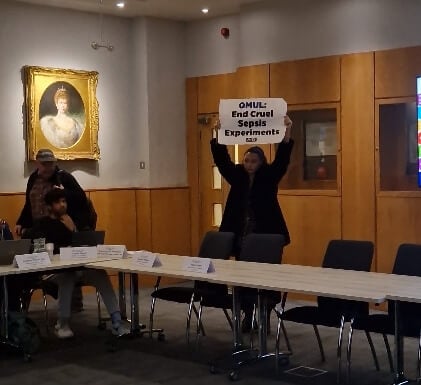 An activist protesting at Queen Mary university