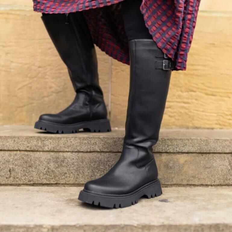Person wearing V.Gan knee high boots