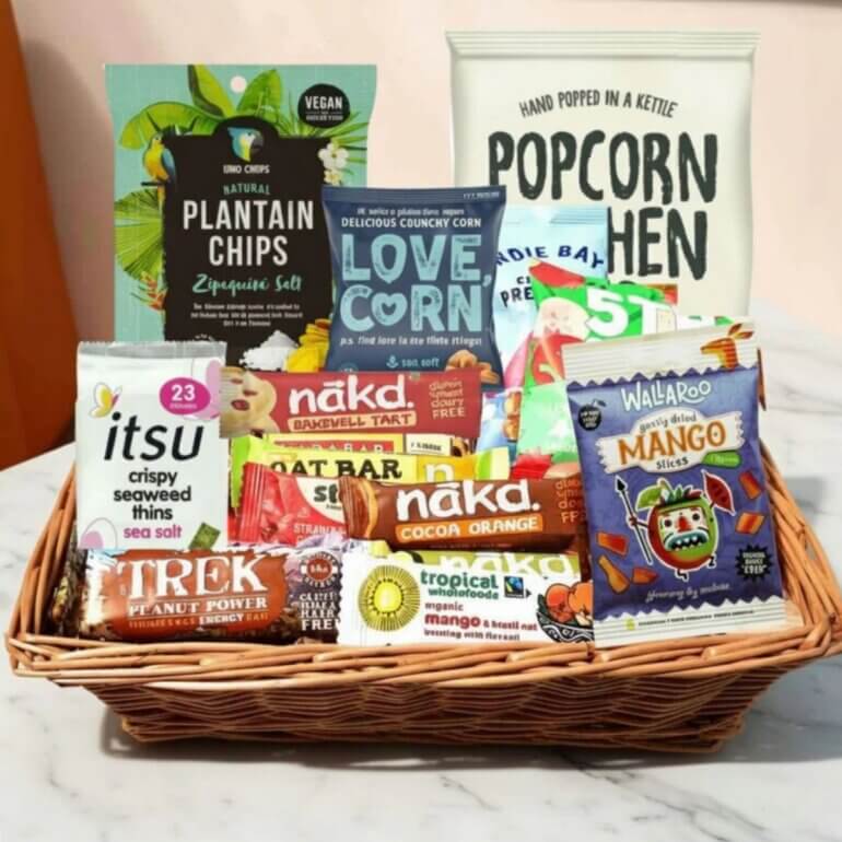 A vegan snacks hamper featuring Nakd bars, Trek bars, and more