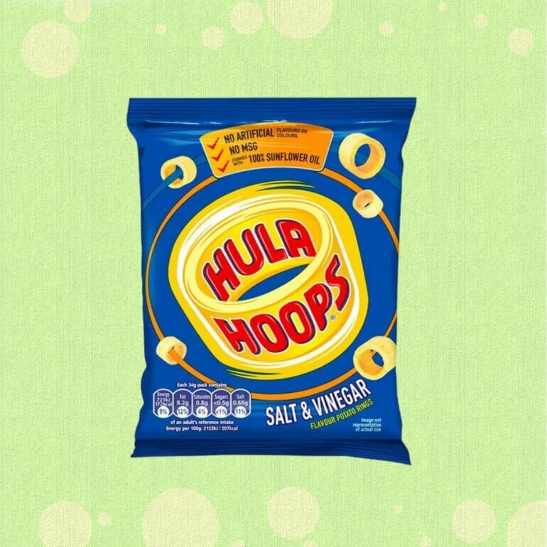 A packet of Hula Hoops in front of a green background