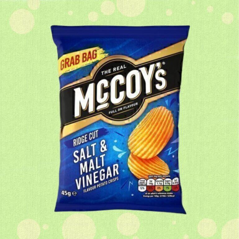 A packet of Salt and Vinegar crisps in front of a green background