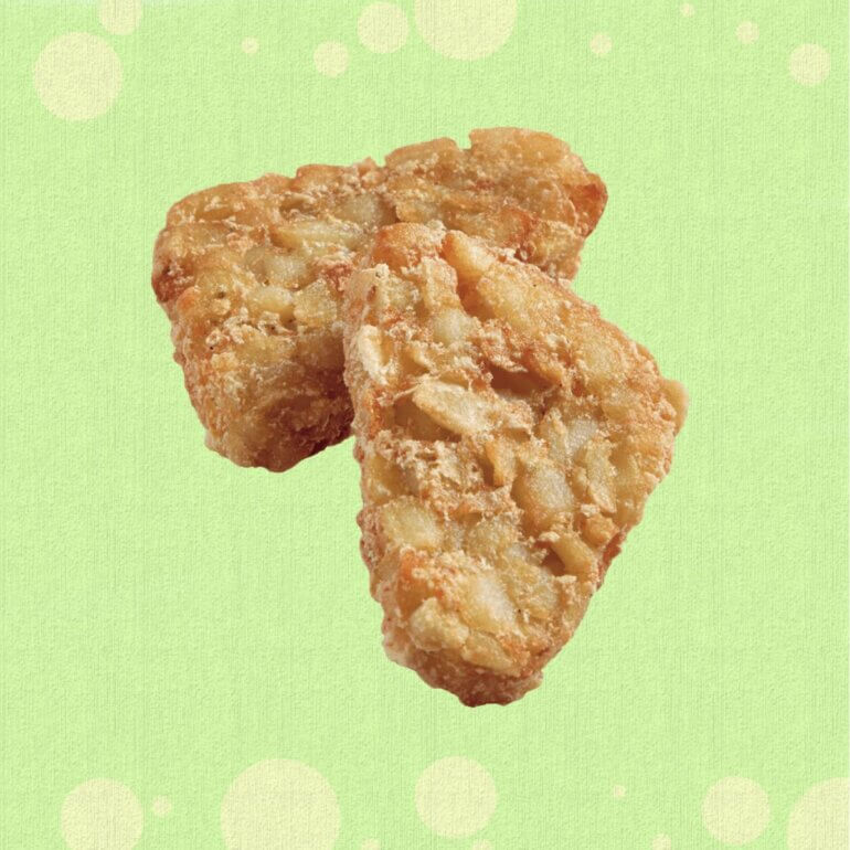 Two Greggs hash browns in front of a green background