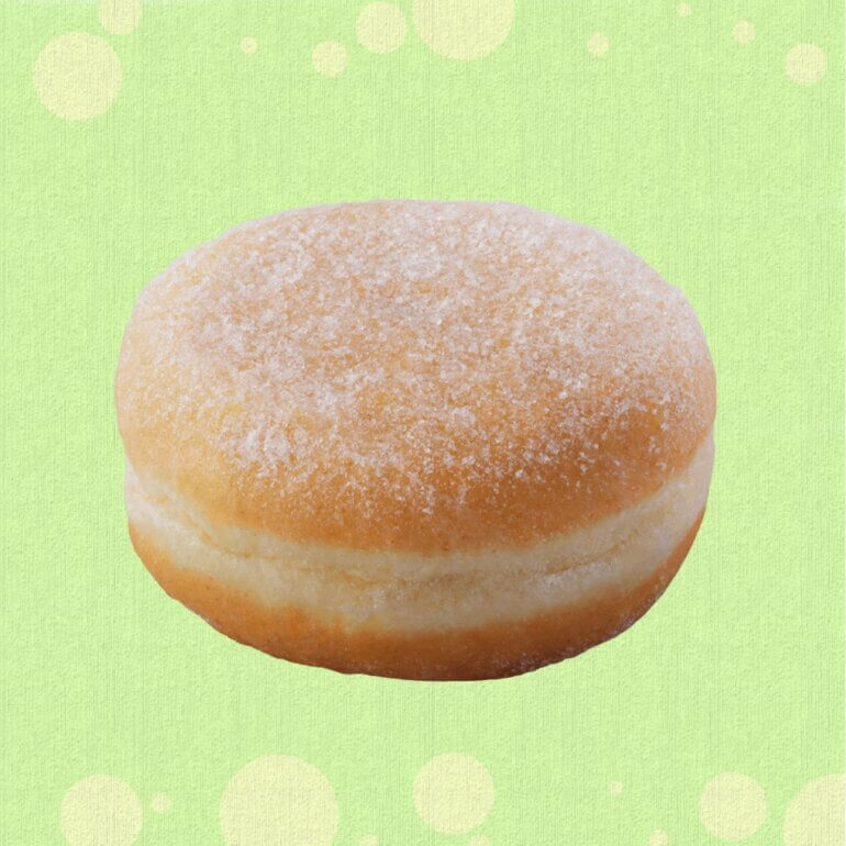 A Greggs vegan jam doughnut in front of a green background