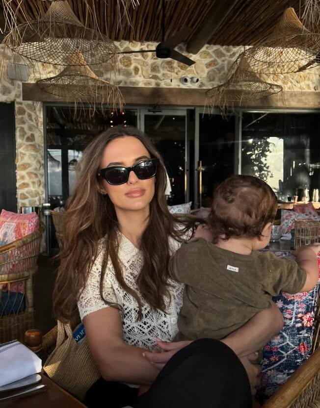 Vegan celebrity Lucy Watson holding her plant-based son Willoughby