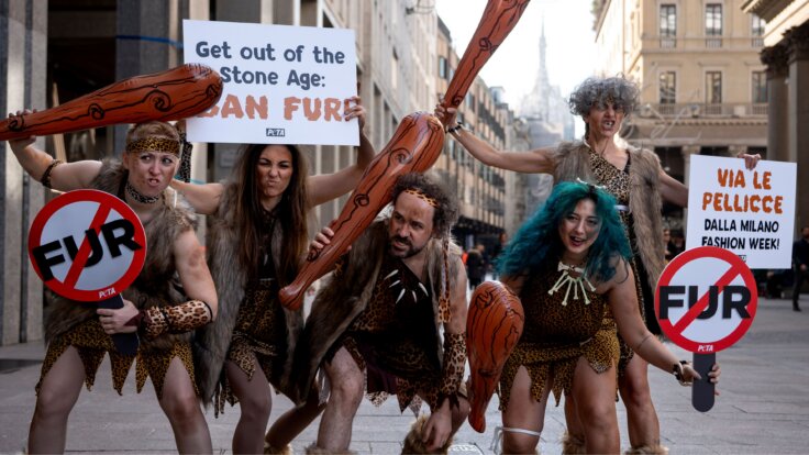 'Cavepeople' protesting Milan Fashion Week