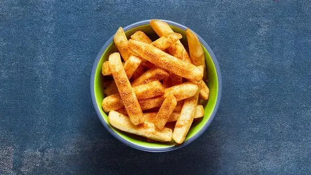 A bowl of PERi-PERi chips from the Nando's vegan menu