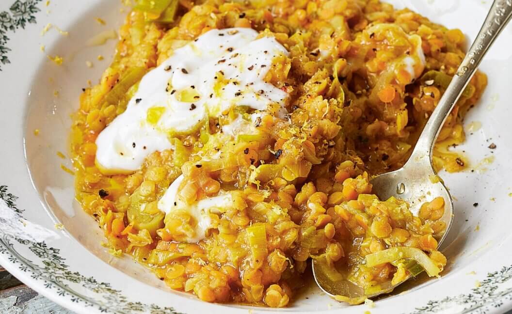 A bowl of leek and lemon lentils with coconut yoghurt