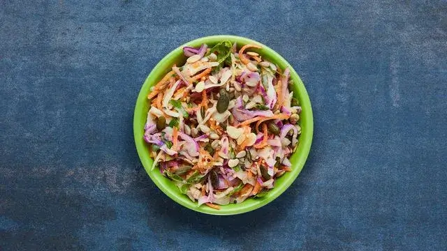 A bowl of Ranbow Slaw from the Nando's vegan menu