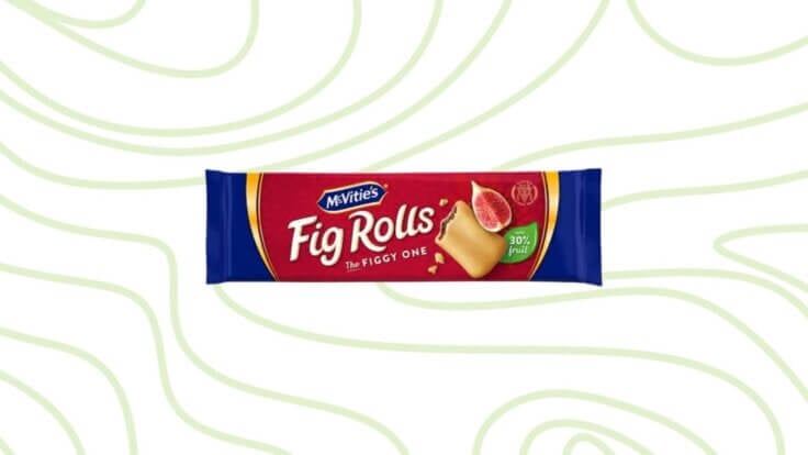 A packet of Fig Rolls in front of a green patterned background