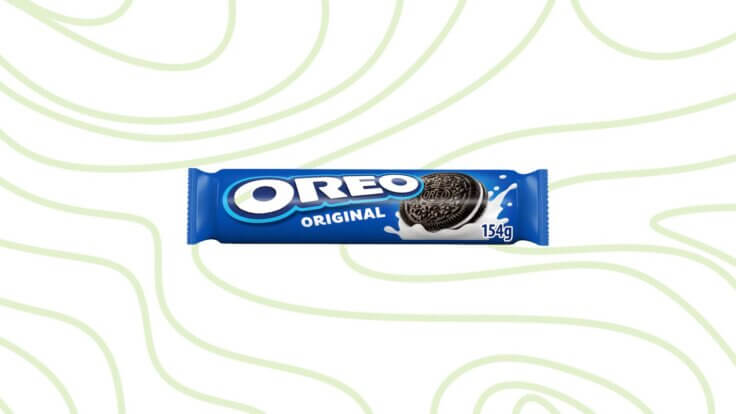 A packet of Oreo biscuits in front of a green background